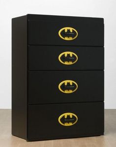 a black and yellow batman dresser with three drawers on each drawer that has the symbol of bat