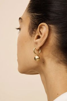 1.Exquisite Design: These dangle huggie earrings boast a contemporary yet classic design, featuring a delicate balance of simplicity and elegance. The 18k gold plating adds a touch of luxury, making them suitable for both everyday wear and special occasions. The dangle hoop design, with a ball drop accent, adds a playful charm to these gold earrings. 2.The gold huggie hoop earrings approx inner diameter are 14mm, outter diameter 18mm, thickness 2mm. The gold beads, with dimensions of 14mm*14mm, lend a noticeable yet refined touch to the overall aesthetic. The 18k gold plating not only enhances the aesthetics of the big earrings, but also ensures durability. The classic gold hoop earrings are full of luster, not easy to rust and discolor, which are durable and comfortable to wear. 3.Two Way Modern Clip-on Huggie Earrings, Modern Yellow Gold Dangle Huggie Earrings, Modern Clip-on Earrings For Everyday Wear, Modern Everyday Clip-on Earrings, Modern Nickel-free Drop Huggie Earrings, Modern Huggie Brass Earrings, Modern Clip-on Dangle Earrings, Modern Brass Huggie Earrings, Minimalist Dangle Hoop Earrings