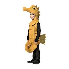 a young boy dressed in a dragon costume