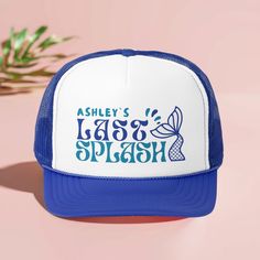 a blue and white trucker hat with the words ashley's lake splash on it