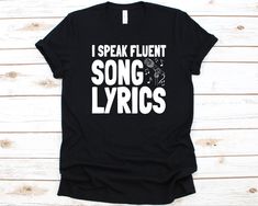 a black t - shirt that says, i speak fluent song lyrics