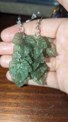 These lovely earrings would be an amazing addition to anyone's jewelry collection! Green Leaf-shaped Sterling Silver Earrings, Mythical Aesthetic, Cottage Outfits, Ivy Earrings, Plant Earrings, Wire Wrapped Jewelry Diy, Witch Jewelry, Funky Earrings, Dope Jewelry