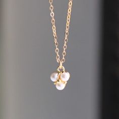 Dainty Pearl Necklace Add a touch of sparkle with our dainty pearl necklace.  This necklace is classic and timeless, making it the perfect gift!  D E T A I L S -Pearl drop approx. 6mm     -Glass pearl and gold plated -High quality 14kt gold filled delicate link necklace -spring ring closure. LENGTH Available in 16, 18 or 20 inches. *Model is wearing 16" in photos HOW TO PERSONALIZE *Select your choices from the drop down menu to create your custom design. ∙ EXTRA LOVE ∙ Handcrafted just for you Elegant Charm Necklaces For Mother's Day Party, Elegant Gold Pearl Necklace For Birthday, Elegant Birthstone Charm Necklaces For Birthday, Delicate Pearl White Necklace For Anniversary, Elegant White Charm Necklace For Birthday, Elegant Pearl Necklace For Birthday, Elegant White Pearl Necklace For Birthday, Elegant Pearl Charm Necklace For Birthday, White Pearl Pendant Necklace For Birthday