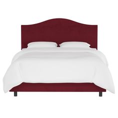 a bed with a red headboard and white sheets on it's sides, in front of a white background