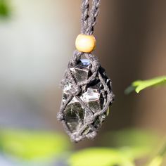 We made by hand all our Russian shungite necklace. The shape is random. The weight of the elite shungite nugget in the necklace varies from: ~ 10-13 gr (0,35-0,45 Oz) and its length can be from 3,5 to 5 cm (1,38-1,97 in). The length of the braided cotton rope is ~ 35-82 cm/32,3'', wood bead adjustable clasp. Black Obsidian Amulet Necklaces, Black Obsidian Amulet Necklace, Black Pendant Crystal Necklaces For Meditation, Black Pendant Crystal Necklace For Meditation, Black Crystal Pendant Necklaces For Meditation, Spiritual Black Necklace With Raw Stone, Black Obsidian Necklace For Healing, Crystal Protection, Elite Shungite