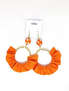 Orange fabric earrings with gold and orange beads Handmade Orange Hoop Earrings For Summer, Bohemian Orange Hoop Earrings For Summer, Orange Earrings With Gold Beads As A Gift, Orange Earrings With Gold Beads For Gift, Orange Beaded Earrings With Dangling Beads For Party, Orange Dangling Beads Earrings For Party, Orange Beaded Dangling Earrings For Party, Bohemian Orange Earrings With Gold Beads, Orange Dangling Beads Earrings For Beach