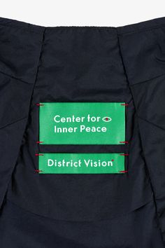 the center for inner peace and district vision labels are visible on an outer portion of a jacket