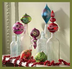 there are many glass bottles with ornaments in them