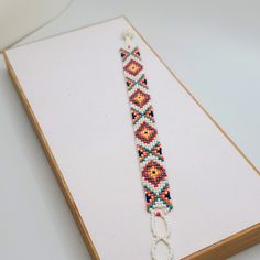 Brilliantly Colored Boho Beaded Handmade Bracelet. White, Red, Blue, Green, Yellow And Orange Beads. Brand New White Beaded Chain Friendship Bracelets As Gifts, White Beaded Chain Friendship Bracelet As Gift, Bohemian White Beaded Chain Bracelet, White Bohemian Beaded Chain Bracelet, White Bohemian Beaded Bracelet, White Beaded Round Friendship Bracelets, White Beaded Bracelets With Colorful Beads, White Bohemian Bracelets With Tiny Beads, Bohemian White Bracelets With Tiny Beads