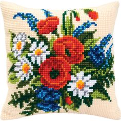 a cross stitch pillow with flowers on it