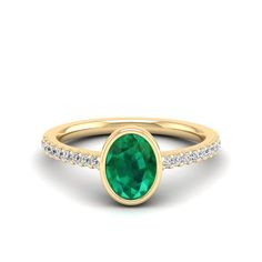 This exquisite ring features a stunning oval emerald stone surrounded by sparkling diamonds, creating a timeless and elegant piece of jewelry. The emerald's rich green hue is complemented by the brilliance of the diamonds, making it a perfect choice for special occasions or as a luxurious everyday accessory. Metal: 14K Gold Setting Type: Prong Rhodium Finish: Yes, on White Gold Gemstone Details: Gemstone: Emerald Shape: Oval Average Dimensions: 8.00 x 6.00 MM Quantity: 01 Average Cut: Very Good Green Emerald Diamond Ring With Pave Setting, Oval Emerald Rings With Pave Setting, Oval Emerald Ring With Pave Setting For Anniversary, Oval Emerald Ring With Pave Diamond Setting, Oval Emerald Ring With Diamond Pave Setting, Oval Emerald Ring With Pave Setting, Oval Emerald Ring With Pave Setting For Formal Occasions, Green Emerald Ring With Pave Setting For May Birthstone, Oval Emerald Ring With Accent Stones