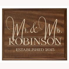 a wooden sign that says mr and mrs robinson established in white lettering on the front