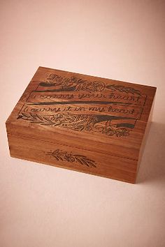 a wooden box with writing on it