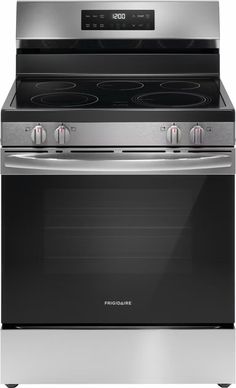 an oven with the door open and two burners on each side, in stainless steel