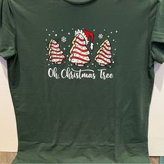 an old christmas tree t - shirt with santa hats on it's head and the words oh, christmas tree