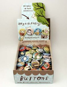 an open box filled with lots of buttons