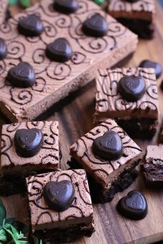 chocolate brownies are arranged on a cutting board