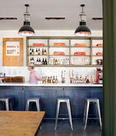 a bar with stools in front of it