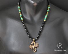 Men's Dragon Necklace Natural Black Onyx Dragon Vein Agate Turquoise Gemstone Protection Beaded Adjustable Macrame Necklace Christmas Gift -ALL THE PRODUCTS AT ELISAJEWELRYART ARE HANDMADE AND MADE WITH NATURAL BEADS. -WHAT DOES THE TURQUOISE STAND FOR Turquoise promotes self-realisation and assists creative problem solving. It is a symbol of friendship, and stimulates romantic love. Turquoise aids in the absorption of nutrients, enhances the immune system, stimulates the regeneration of tissue, Agate Black Beads Necklace As Gift, Agate Black Beads Necklace For Gift, Agate Necklace With Black Beads As A Gift, Agate Necklace With Black Beads For Gift, Turquoise Jewelry With Black Beads For Gift, Green Jewelry With Black Beads As A Gift, Green Jewelry With Black Beads For Gift, 8mm Bead Pendant Jewelry As Gift, Handmade Adjustable Black Turquoise Necklace