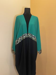 Introducing our beautiful cardigan dress, available in classic black and vibrant green. Crafted from an amazing, high-quality fabric, this one-size-fits-all dress drapes effortlessly over any figure, offering both comfort and style. Its versatile design makes it perfect for any occasion, blending the coziness of a cardigan with the elegance of a dress. Embrace sophistication and ease with this must-have piece in your wardrobe. Elegant Green V-neck Cardigan, Green Long Sleeve Abaya For Evening, Elegant Green Wrap Kimono, Elegant Green V-neck Kimono, Elegant V-neck Green Kimono, Black Long Kaftan One Size, Green V-neck Abaya, Elegant Long Green Kimono, Black One Size Open Front Kimono