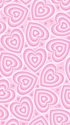 a pink and white background with lots of hearts in the shape of heart shaped shapes