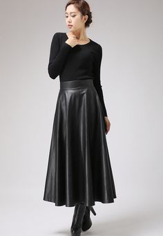 "This faux leather skirt is a timeless piece that goes with everything . This PU vegan skirt looks good away and can dress up or down with swift change of top and shoes. This maxi skirt should be your new wardrobe staple DETAIL * Soft black PU fabric * Vegan fabric * Polyester lining * Back zip closure * Two seam pockets * Midi calf Length * Suit for Autumn, winter and spring SIZE GUIDE Size vary between Brand and Country Please get your body measurement with our Size Guide And Find your size in Fitted Flared Leather Skirt, Elegant Long Leather Skirt, Leather Flared Skirt For Fall, Relaxed Flared Leather Skirt, Fall Leather Flared Skirt, Faux Leather Lined Midi Skirt, Elegant Faux Leather Midi Skirt, Elegant Faux Leather Pleated Skirt, Elegant Pleated Faux Leather Skirt