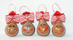 three brown christmas ornaments with red bows on them, one has a turkey face and the other has a ginger nose