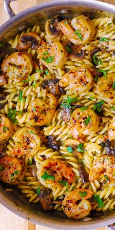 pasta with shrimp and mushrooms in a pan