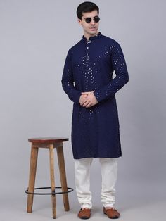 Colour: Dark Blue Geometric woven design Shirt collar Long, regular sleeves Beads and stones detail Above knee Machine weave regular cotton Material & Care 100% CottonHand wash Dispatch within 7 days Indigo Cotton Kurta For Festive Occasions, Blue Sequined Kurta For Diwali, Blue Cotton Kurta With Mirror Work, Embellished Blue Kurta For Eid, Blue Embellished Kurta For Festive Occasions, Blue Embellished Kurta For Eid, Embellished Cotton Kurta For Eid, Fitted Long Sleeve Embellished Kurta, Traditional Blue Kurta With Sequins