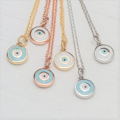 Tiny 14k solid gold round evil eye pendant. The eye is available with a light blue center and a white outer edge or with a white center and a blue outer edge. Please make your choice from the drop down menu. The 14k solid gold chain is available in 3 different lengths, please make your choice from the drop down menu. The pendant measures about 7 mm / 1/3 inch . Also available as a bracelet and ring. Perfect gift for Valentine or any other special occasion. Comes in a gift box. DHL EXPRESS shippi Silver Evil Eye Necklace In 14k Gold, 14k Gold Round Evil Eye Charm Necklace, 14k Gold Charm Necklace With Evil Eye, 14k Gold Silver Evil Eye Necklace, Silver 14k Gold Necklace With Evil Eye, Silver 14k Gold Evil Eye Necklace, 14k Gold Evil Eye Charm Necklace With Round Pendant, Sterling Silver Evil Eye Jewelry In Rose Gold, Sterling Silver Rose Gold Evil Eye Jewelry