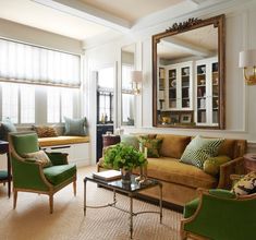 a living room filled with furniture and a large mirror