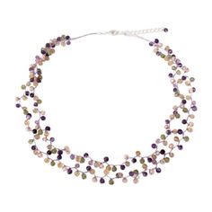 Beautiful gems make up the complexity of this exquisitely beaded necklace. Anusara knots the gems with light purple silk threads, strategically adding cream pearls and glass beads to create a fascinating effect. The necklace features a sterling silver plated brass clasp and extender chain. Elegant Adjustable Crystal Necklace With Colorful Beads, Elegant Multi-strand Purple Beaded Necklaces, Elegant Purple Multi-strand Beaded Necklaces, Elegant Lavender Crystal Necklace With Round Beads, Adjustable Purple Pearl Necklace With Round Beads, Adjustable Beaded Purple Pearl Necklace, Adjustable Purple Beaded Pearl Necklace, Purple Pearl Jewelry With Gemstone Beads, Elegant Adjustable Purple Beaded Necklaces