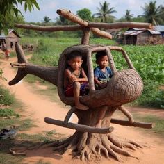 two children are sitting in a tree house