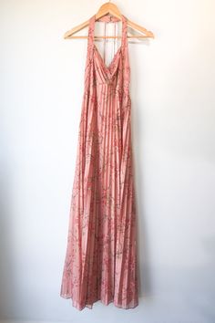 Vintage Mary Lou's Bridal Pleated Halter Dress. Overall great condition, has a few signs of wear, see photos. Pink cherry blossom printed knit dress with a bit of shine. Pleated maxi skirt and halter neckline. Zipper back closure and hook and eye and neck. No marked content, feels like polyester, dry clean only. No marked size, fits XS/S. Approx. Measurements: Underarm to Underarm: 16" High Waist: 14" Length: 58" Spring Evening Sundress Maxi Dress, Spring Evening Maxi Dress, Spring Evening Halter Neck Maxi Dress, Pink Halter Neck Maxi Dress For Date Night, Spring Backless Maxi Dress For Date Night, Spring Maxi Dress For Date Night, Evening Floral Print Maxi Dress With Halter Neck, Spring Floor-length Maxi Dress For Date Night, Pink Flowy Halter Neck Dress