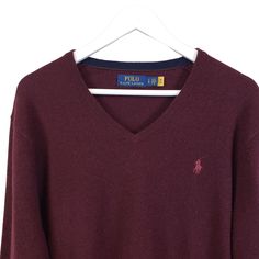 Really nice burgundy color v-neck sweater that is 100% wool but still pretty soft. Pair with a button down shirt underneath for work or a dinner date. There is very faint pilling on this but still in good condition with a lot of life in it.NOTE that preloved pieces may have changed in size with wash and wear so please check approximate measurements for current size and fit.Size: Mens LApproximate Measurements Lying Flat: Bust 22 in Waist 21.5 in Length 26.5 inCondition: Pre-Owned GoodAll pieces Dinner Date, Burgundy Color, V Neck Sweater, Vneck Sweater, Neck Sweater, Polo Ralph, Sweater Sizes, Really Cool Stuff, Button Down Shirt