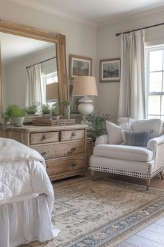 a bedroom with a bed, chair and mirror in it's centerpieces