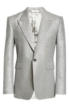 Strong, padded shoulders and impeccable tailoring bring McQueen's signature touch to a structured sport coat updated in a sparkling silver fabrication. 31" length (size 50 EU) One-button closure Peaked lapels Chest welt pocket; front flap pockets Back vent Lined 70% viscose, 15% polyamide, 15% metallic fibers Dry clean Made in Italy Designer Clothing Luxury Outerwear With Pressed Crease For Parties, Elegant Silver Blazer For Evening, Elegant Metallic Long Sleeve Blazer, Elegant Silver Evening Blazer, Elegant Metallic Outerwear For Work, Fitted Silver Blazer For Evening, Formal Metallic Long Sleeve Outerwear, Metallic Long Sleeve Formal Outerwear, Fitted Metallic Blazer For Formal Occasions