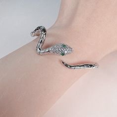 This bohemian snake wrap open bangle bracelet features a unique snake wrap design with great detail and open bangle for easy fitness. Material of this serpent bangle bracelet is 3-layer platinum plate over copper alloy. Thick layer of plate will help the bracelet remain shine for a long time. Bracelet inner diameter is 2.16 in (55 mm), fit loose. Jewelry Care: See more information about how to care for your jewelry here. Shipping Policy: Orders will be shipped within 1-3 business days. Economy s Silver Metal Snake Bracelets, Silver Metal Snake Bracelet, Elegant Silver Snake-shaped Bracelets, Elegant Silver Snake Shape Bracelet, Silver Snake-shaped Bracelet For Parties, Adjustable Trendy Snake Jewelry, Trendy Snake-shaped Metal Jewelry, Elegant Adjustable Snake Bangle, Trendy Silver Snake-shaped Jewelry