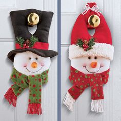 two snowmen wearing hats and scarves hanging on a door with the words, two piece set