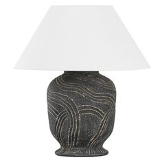 a black and white table lamp with a white shade on the top, against a white background