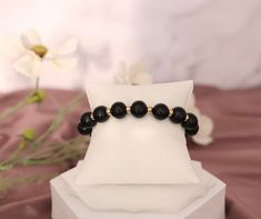 This Black Beads and Gold Clip Elastic Bracelet is so much fun to wear every day! It's comfortable and stylish, and goes with almost any outfit. Casual Black Beads Stretch Bracelet Gift, Casual Black Beads Stretch Bracelet, Casual Beaded Bracelets With Black Beads As Gift, Trendy Black Bracelets With Colorful Beads, Casual Black Beaded Bracelets With Large Beads, Casual Black Beaded Bracelet With Large Beads, Black Bracelets With Large Beads For Gift, Black Bracelets With Large Beads As Gift, Trendy Black Beaded Bracelet With 8mm Beads