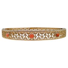 This 14k gold coral bangle is a contemporary piece. Three stunning coral stones take center stage, each delicately cradled in the warm embrace of 14k gold. Their gentle hues bring to mind the soft caress of the sea breeze and the sun's gentle kiss. The coral stones are framed by extensive filigree and milgrain accents that dance like linen in the summer breeze. Like delicate tendrils of dreams, the filigree wraps the entire bangle, creating an enchanting play of light and shadow that dances with Coral Bangles Gold, Coral Bangles, Coral Bracelet, Dance With You, Coral Stone, Sea Breeze, Summer Breeze, Gold Jewellery Design, Jewellery Design