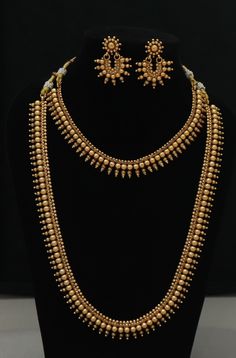 Gift yourself a royal look with this perfectly short and long necklace set from ISMI CREATIONS. Crafted with high quality gold platings, it is impressive in design. Perfect for weddings and festivities, this gold necklace set should be put on with your favorite sari, lehenga or any party wear dress Raw material - artificial, imitation jewelry,  Long Necklace Length  = 21 CM  Short Necklace Length  = 10 CM Earrings Length   = 4.5 CM 100% Satisfaction Guarantee: 1 Year Warranty, Long Lasting Plati Luxury Gold Temple Necklace For Diwali, Diamond And Gold Necklace, Classic Gold Necklaces For Festive Occasions, Classic Gold Necklace For Festive Occasion, Gold Long Necklace Temple Jewelry Set, Classic Gold Jewelry Sets For Celebration, Elegant Temple Necklace With Latkans For Party, Elegant Party Temple Necklace With Latkans, Elegant Gold Jewelry Sets With Latkans