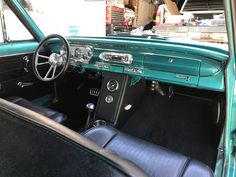 the interior of an old car is green and black