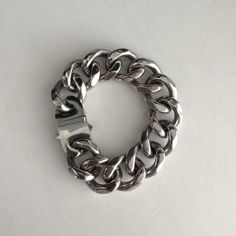 Silver curb chain bracelet, wide curb chain at 1". Buckle closure, 1.5" by 0.75". High shine polished stainless steel, no tarnish, statement piece, heavy duty. Perfect gift for both men and women.  can be made with small chain  We ship in 1-3 days, all purchase come with complimentary jewelry box and pouch and polish cloth. Thick Chain Bracelet, Modern Bracelets With Chunky Cuban Link Chain, Modern Chunky Chain Cuban Link Bracelets, Modern Chunky Chain Link Bracelets, Modern Chunky Cuban Link Chain Bracelet, Metal Cuban Link Bracelet, Stainless Steel Cuban Link Curb Chain Bracelet, Metal Cuban Link Bracelet With Curb Chain, Cuban Link Bracelet With Curb Chain In Metal