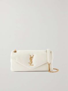 SAINT LAURENT Calypso padded leather shoulder bag | NET-A-PORTER Ysl Handbags, Cream Bag, Cream Bags, High Heel Rain Boots, The Saint, Saint Laurent Bag, Stylish Bag, Quilted Leather, Leather Pouch