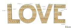 the word love is made out of wood and has holes for letters to cut into it