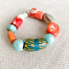 Trulli Bracelet, ocean blues meet summer peach. Only at BelleStyle.com. Artisan Wooden Beads Bracelet For Meditation, Artisan Wooden Beads Bracelets For Meditation, Artisan Orange Bracelets With Colorful Beads, Artisan Orange Bracelet With Colorful Beads, Spiritual Turquoise Beaded Bracelets With Wooden Beads, Spiritual Turquoise Beaded Bracelet With Wooden Beads, Bohemian Red Coral And Wooden Beads, Vibrant Red Bracelets For Gift, Unique Wooden Beaded Bracelets For Healing