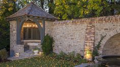 an outdoor gazebo in the middle of a garden