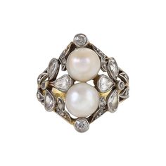 An Edwardian ring featuring two pearls and 22 diamonds set in platinum, with an 18 karat gold shank. The two pearls, which stack up the finger, are elegantly framed by a naturalistic motif echoing the form of a clover made of pear-cut diamonds. The ring is further accented by leaf-like scroll forms studded with old European-cut stones in refined Edwardian brilliance. The diamonds have an approximate total weight of 1.5 carats. Circa 1910. Ring size is 5 and it can be resized. European Cut Diamond Ring, Edwardian Ring, Vintage Cocktail Ring, Baguette Diamond Rings, Pearl And Diamond Ring, Platinum Diamond Rings, Pear Cut Diamond, Vintage Cocktail, Real Pearls